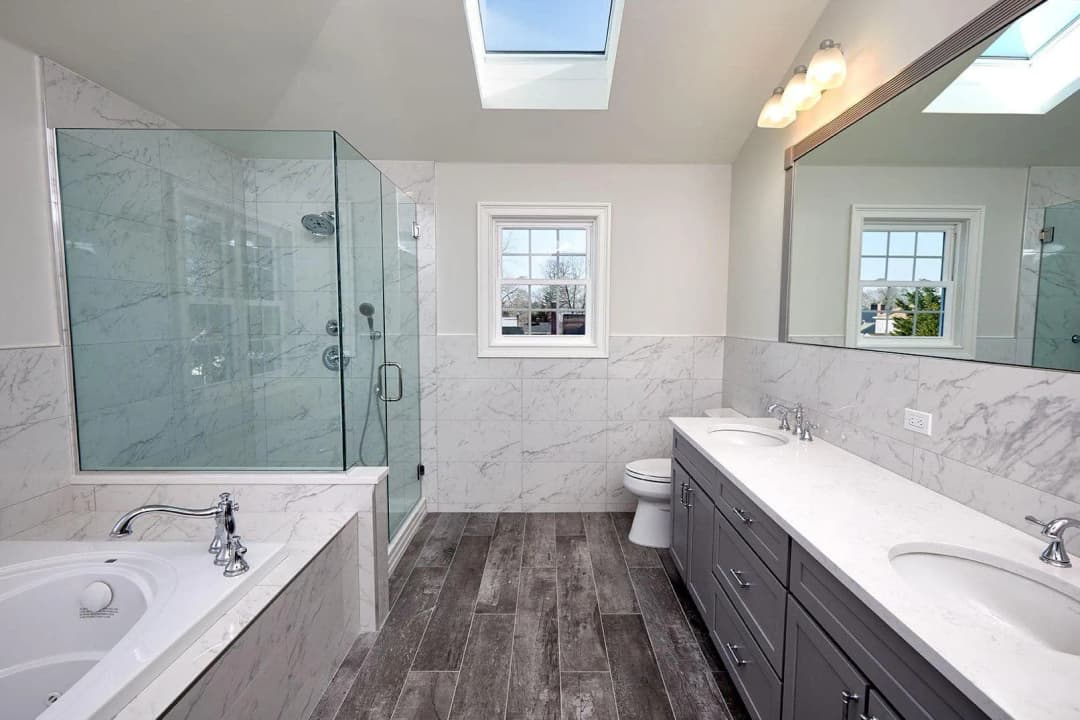 A modern bathroom with sleek fixtures and a large mirror.