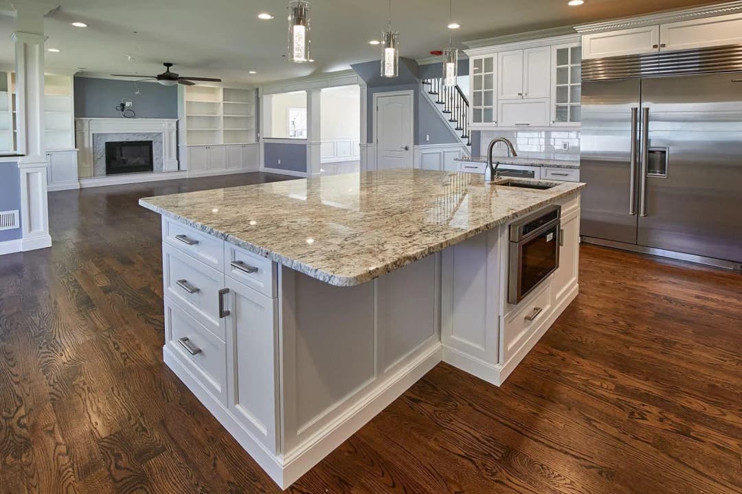 Luxurious marble countertops in a spacious kitchen.