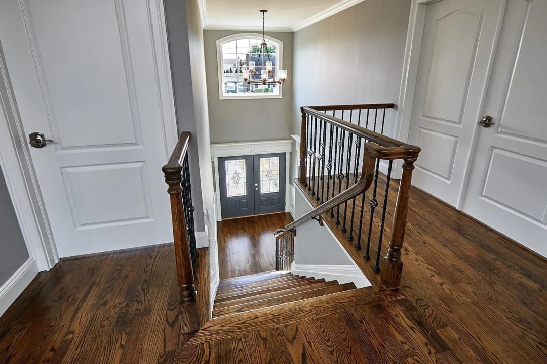 Wooden stairs with polished floors leading to the next level.