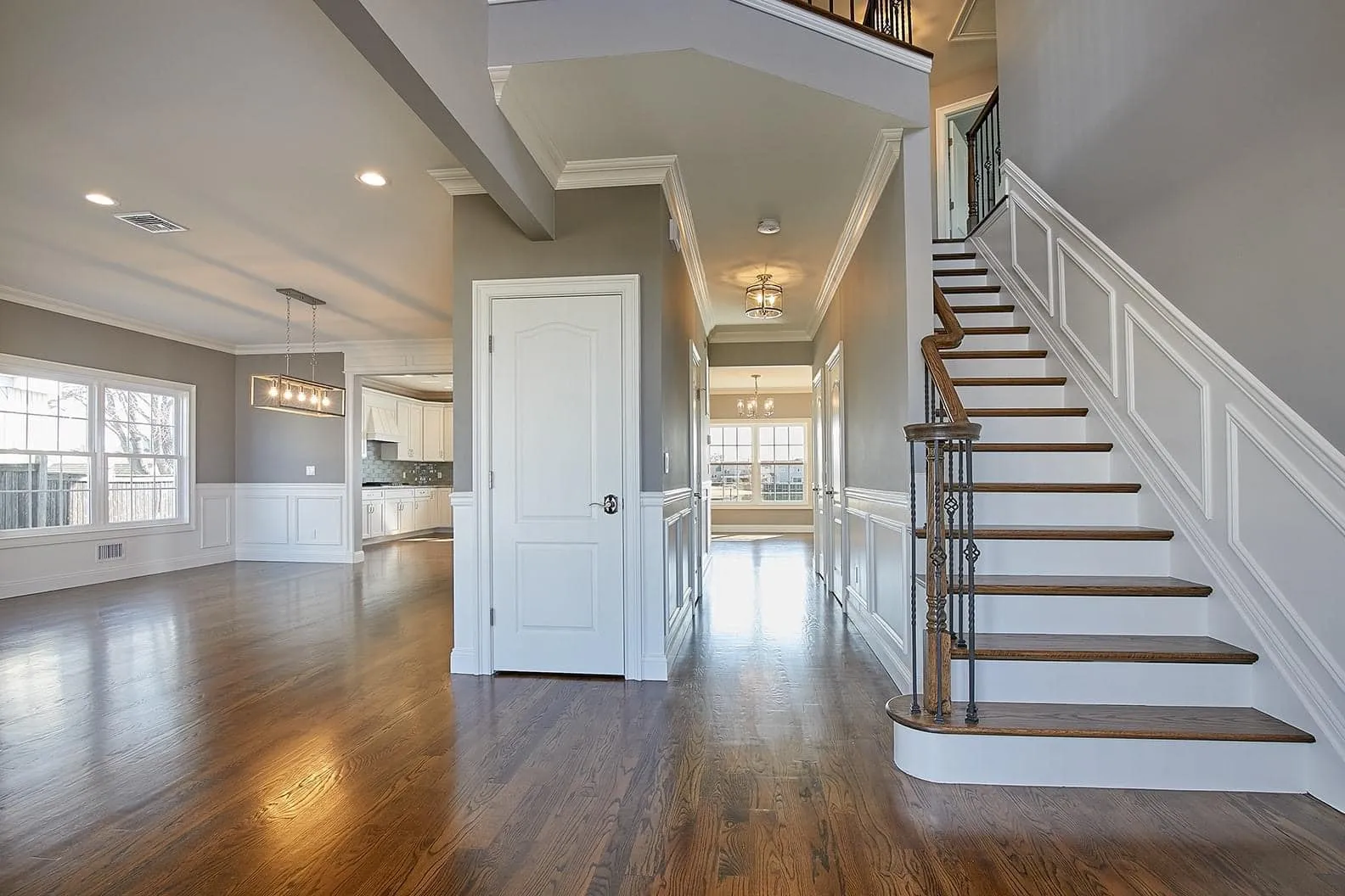 A spacious living room with modern furniture and decor.