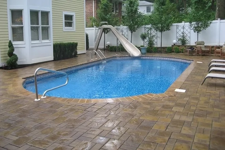 Clean and polished pavers around a swimming pool